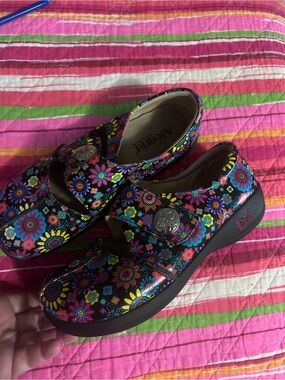 Alegria Black Floral Print Clogs with Silver Button